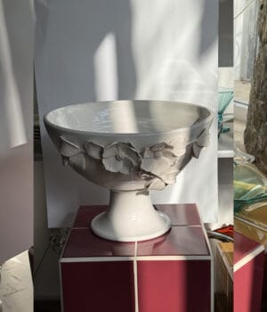 White ceramic bowl with embossed flowers design